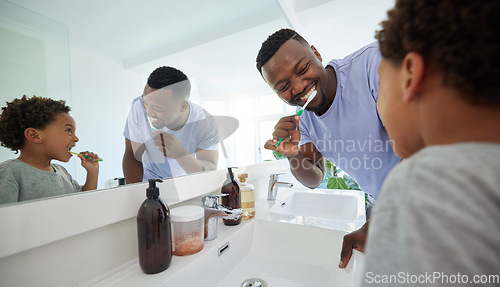 Image of Smile, brushing teeth and father with son in bathroom for dental, morning routine and cleaning. Teaching, self care and toothbrush with black man and child at home for family wellness and hygiene