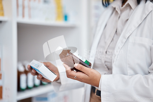 Image of Pharmacy stock, hands and drug information of medicine and pills ingredients checklist. Pharmacist, work and pharmaceutical products in a retail shop or clinic with wellness employee reading label