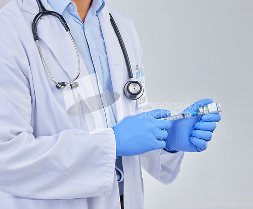 Image of Injection, doctor hands and vaccine vial in studio for safety, healthcare and pharmaceutical medicine. Closeup, vaccination and liquid bottle for virus risk, immunity and medical antibiotics drugs