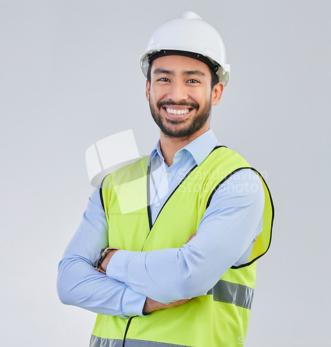 Image of Construction worker, engineer and studio portrait of happy man in vest and helmet for safety on white background. Smile, contractor or architect in planning or renovation, project manager in India.