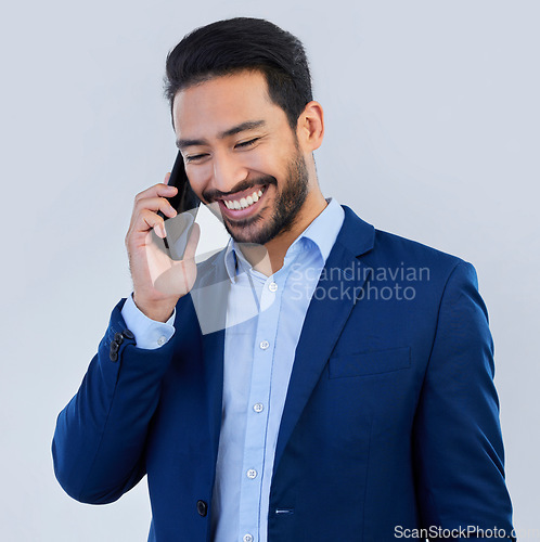 Image of Smile, phone call and asian businessman in studio, talking and networking on white background. Smartphone, conversation and man in suit, communication and technology for investor trading at startup.