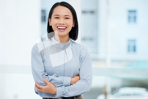 Image of Asian, business woman and arms crossed, smile in portrait and professional mindset with positivity and success. Mockup space, corporate female and happy in career, ambition and empowerment with pride