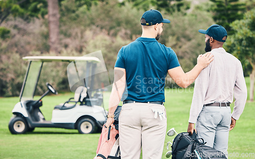 Image of Golf, sports and friends on course with golfing bag of clubs for game, practice and training on lawn. Professional golfers, teamwork and back of men on grass for exercise, fitness and recreation