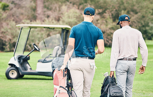 Image of Golf, sports and men on course with golfing bag walking to cart after game, practice and training on lawn. Professional golfers, fun and back of friends on grass for exercise, fitness and competition