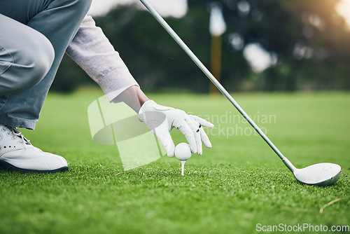 Image of Sports, golf ball and tee with hand of black man on field for training, tournament and challenge. Start, competition match and ready with athlete and club on course for action, games and hobby