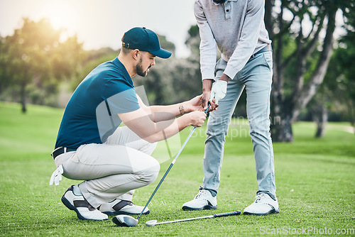 Image of Golf lesson, teaching and sports coach help man with swing, putt and stroke outdoor. Lens flare, green course and club support of a athlete ready for exercise, fitness and training for a game