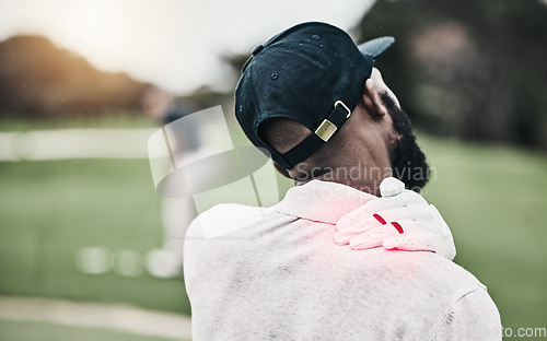 Image of Sports, injury and golf course, black man with shoulder pain during game, massage and relief in health and wellness. Green, hands on muscle in support and golfer with body ache during golfing workout