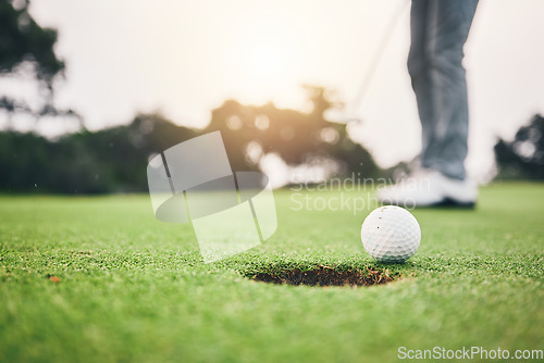 Image of Sports, golf ball and hole on course in club for competition match, tournament and training. Target, challenge and games with equipment on grass field for practice, recreation hobby and practice