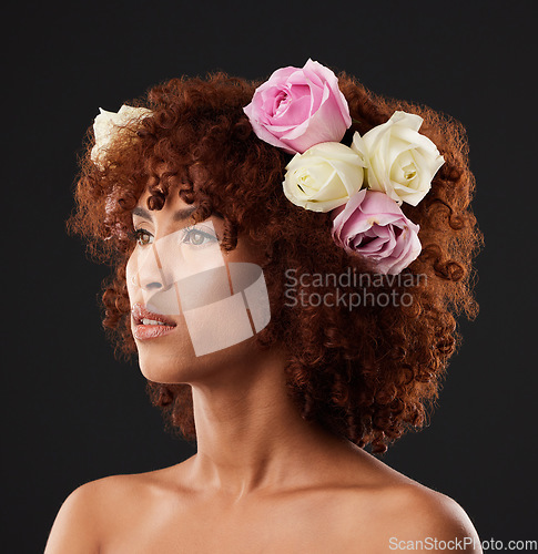 Image of Thinking, beauty and flowers with a model black woman in studio on a dark background for natural skincare. Wellness, luxury and idea with an attractive young female wearing a flower crown or wreath
