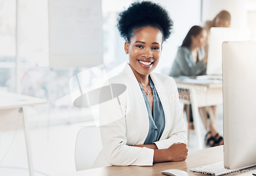 Image of Leadership, happy and portrait of a businesswoman in the office with a computer working on a project. Happiness, smile and African female corporate manager sitting at her desk with a pc in workplace.