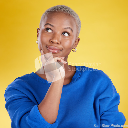 Image of Thinking, solution and face of black woman in studio, yellow background and backdrop. Female model brainstorming decision, ideas and question of planning, choice and inspiration of memory for mindset