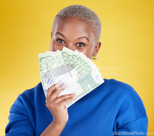 Image of Money winner, portrait and black woman with euros in studio isolated on a yellow background. Financial freedom, wealth and face of rich female with cash after winning lottery, prize or competition.