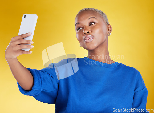 Image of Selfie, smile and beauty of black woman in studio isolated on a yellow background. Photographer, social media and African female model taking pictures or photo for profile picture and happy memory.