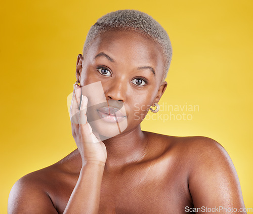 Image of Face portrait, skincare and beauty of black woman in studio isolated on a yellow background. Natural, makeup cosmetics and confidence of African female model with facial treatment for healthy skin.