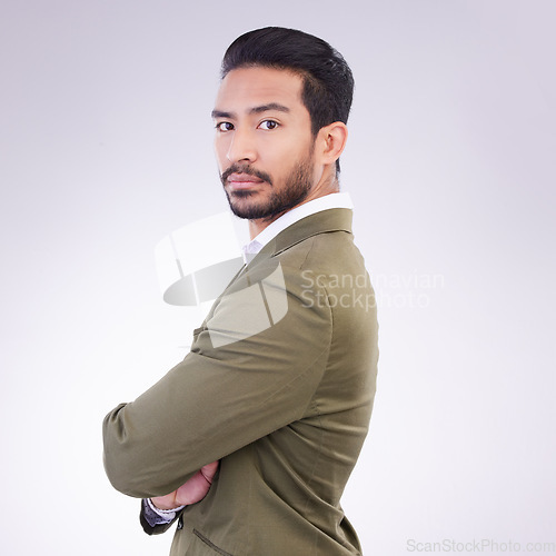 Image of Business man, serious and portrait with arms crossed in studio with pride for career on gray background. Asian male entrepreneur with dedication and ambition for professional occupation mockup space