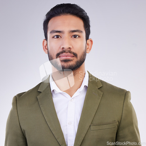 Image of Business man, serious face and portrait in studio with pride for career or job on a gray background. Asian entrepreneur person with dedication and ambition for professional occupation and mindset
