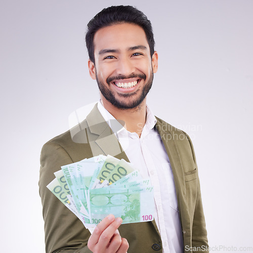 Image of Money, cash and happy man face isolated on a white background business wealth, bonus or investing profit. Winner, banking or rich accountant or Asian person with financial freedom in studio portrait