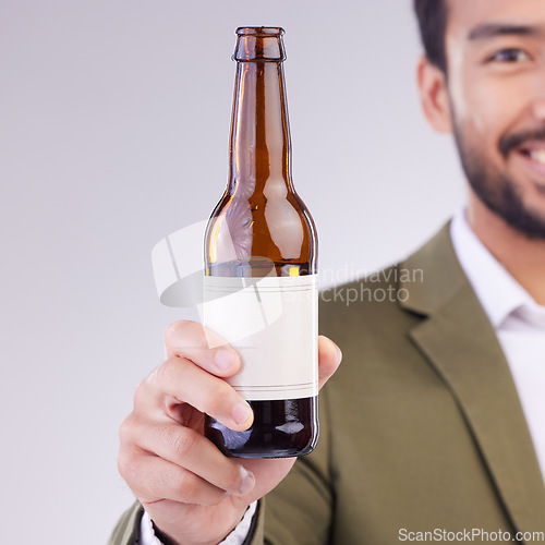 Image of Man face with beer bottle isolated on a white background for alcohol product promotion drink, happy hour and cheers. Professional Asian person or model hand holding wine glass container in studio