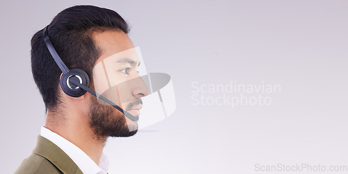 Image of Call center, man and face profile with headset and mic, CRM and contact us with mockup space. Communication, customer service or tech support with telemarketing and serious male on studio background