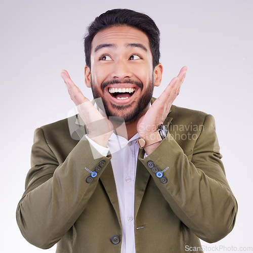 Image of Happy, excited and young businessman in a studio with wow, omg or wtf face expression. Happiness, surprise and corporate male model from India with a shock or amazed facial gesture by gray background