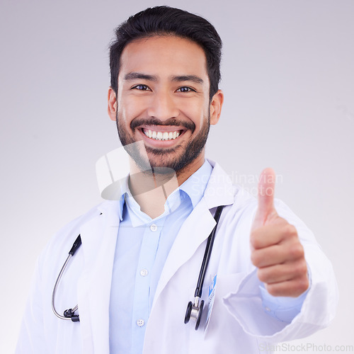 Image of Portrait of man doctor thumbs up isolated on a white background support, thank you and healthcare services goals. Medical asian professional in like, agreement or success hand sign or emoji in studio