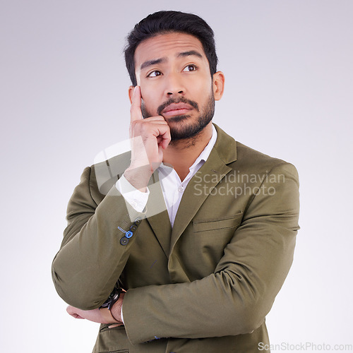 Image of Business man, thinking and planning in studio with ideas or strategy on gray background. Asian male entrepreneur think with hand and arms crossed pensive or contemplating question, thought or mission