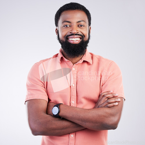 Image of Happy, arms crossed and portrait of black man in studio for confidence, positive and laughing. Funny, carefree and happiness with male isolated on gray background for cheerful, achievement and pride