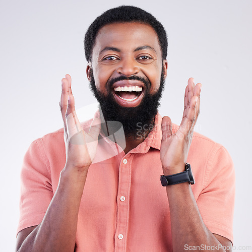 Image of Happy, surprise and portrait of black man in studio for shocked, announcement and accomplishment. Smile, winner and achievement with male on gray background for celebration, omg and good news