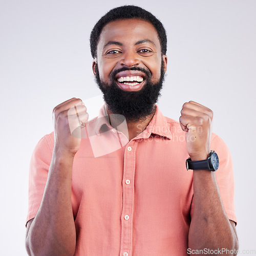 Image of Portrait, happy black man and fist of winner in studio of celebration, achievement deal or success. Excited male model celebrate winning news, lottery giveaway and smile of victory, motivation or yes