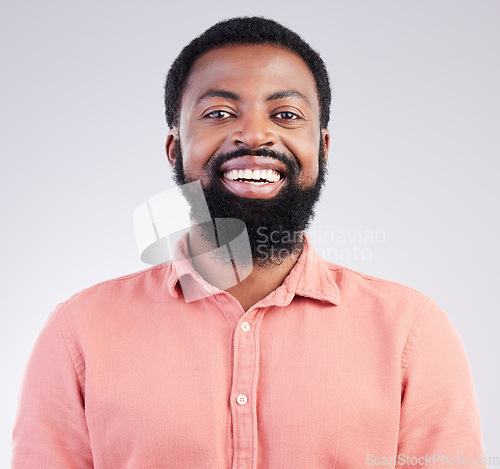 Image of Happy, confident and portrait of black man in studio for smile, positive and laughing. Funny, carefree and happiness with male isolated on gray background for cheerful, achievement and pride
