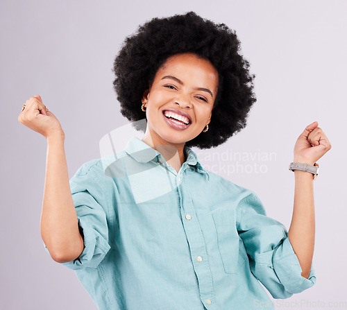 Image of Happy, smile and portrait of black woman in studio for celebration, surprise and confidence. Winner, happiness and good news with female isolated on gray background for cheerful, yes and excited