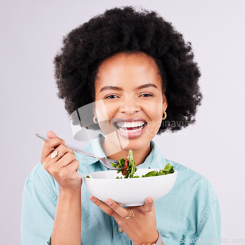 Image of Health, salad and portrait of a black woman in studio eating vegetables for nutrition or vegan diet. Happy African female with a smile for healthy food, detox and wellness benefits for motivation