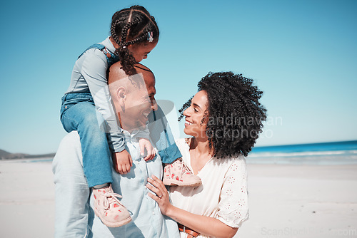 Image of Happy, love and family at the beach while on a vacation, adventure or summer weekend trip. Happiness, smile and girl child by the ocean with her parents while on a tropical seaside holiday in Mexico.