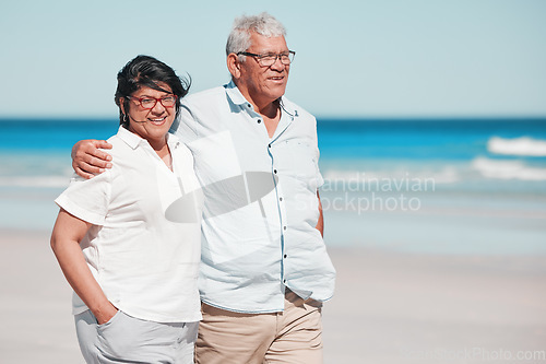 Image of Senior couple walking on beach for love, care and relax on summer holiday in nature, sunshine or trust. Happy retirement, man and woman walk at sea, happiness and travel with partner, smile and ocean