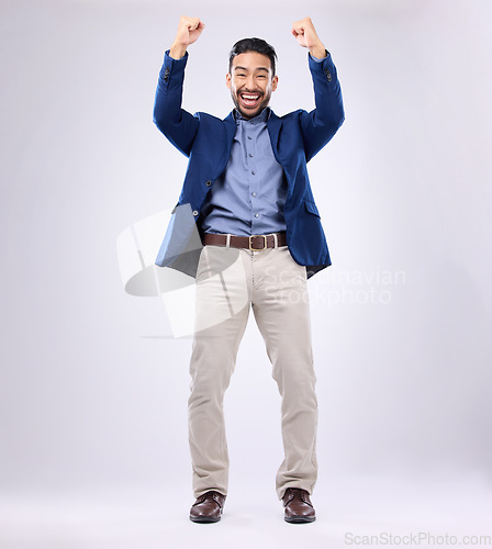 Image of Winner, celebration and portrait of man with excited, cheering and achievement on white background. Success, winning mockup and isolated happy male with fists in air for victory, bonus and good news