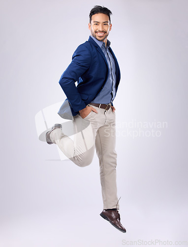 Image of Jump, happy and portrait of man in studio with positive mindset, happiness and joy on white background. Winner, success mockup and isolated male jumping with smile for energy, freedom and confidence