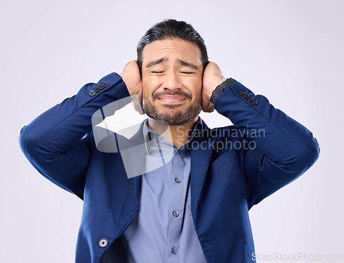 Image of Employee, noise and Asian man cover ears, stress and mental health against a grey studio background. Japan, male and guy with hands on temples, loud and depression with frustration, audio and sound