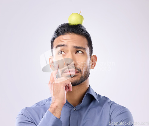 Image of Apple, head balance and man thinking of fruit product choice for weight loss diet, healthcare food or detox. Nutritionist face, studio person and contemplating male vegan isolated on gray background