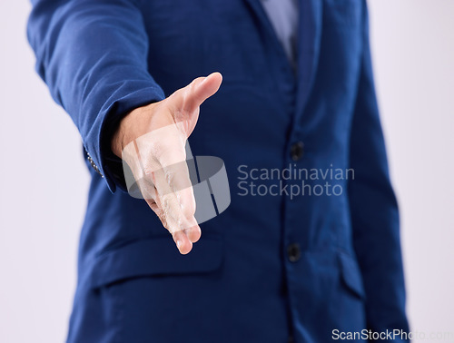 Image of Open hand shake, studio and business man with welcome, deal or agreement for partnership by background. Zoom, entrepreneur and handshake for hiring opportunity, greeting or onboarding with respect