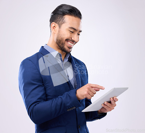 Image of Man, business and tablet with a smile in studio for communication and network connection. Asian male model isolated on a gray background with tech for mobile app, online chat and search on internet