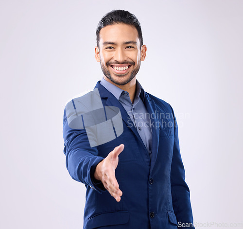 Image of Business man, handshake and studio portrait for welcome, smile or agreement for partnership by background. Asian young entrepreneur, shaking hands or excited face for opportunity, greeting or respect