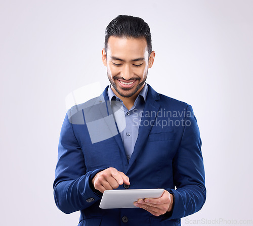 Image of Asian man, business and tablet in studio for communication and network connection. Happy male model isolated on a gray background with tech for mobile app, online chat and typing search on internet