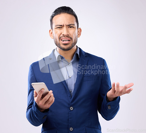 Image of Portrait, smartphone and Asian man confused, frustrated and guy against grey studio background. Face, male employee and consultant with cellphone, doubt and uncertain with stress, unsure or confusion