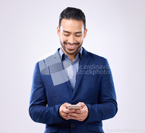 Image of Asian man, business and phone in studio for communication and network connection. Happy male model isolated on a gray background with smartphone for mobile app, online chat and typing on internet