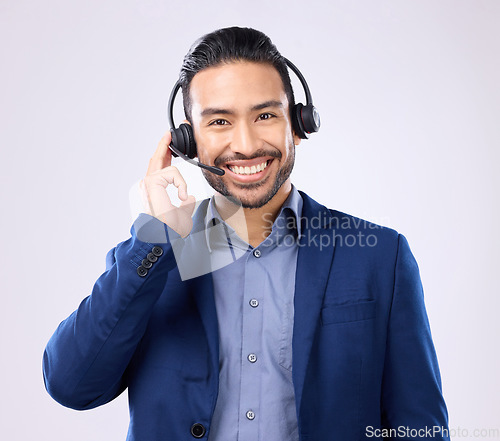 Image of Headset portrait of happy man isolated on a white background call center, telecom job or global support. International callcenter agent, consultant or business person face in studio communication