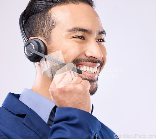 Image of Call center, headset and happy man isolated on a white background for telemarketing, telecom or global support. Asian international agent, consultant or business person for virtual salesman in studio