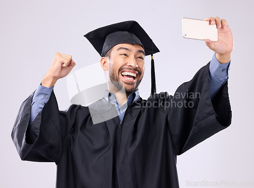 Image of Man, graduate and selfie with smile for scholarship, profile picture or social media against a gray studio background. Happy excited male academic smiling for graduation photo, memory or online post