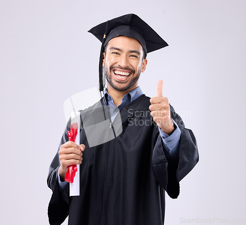 Image of Graduation man, diploma and thumbs up in studio portrait for achievement, education or goals by background. Happy student, certificate or smile for success, award or excited graduate with celebration