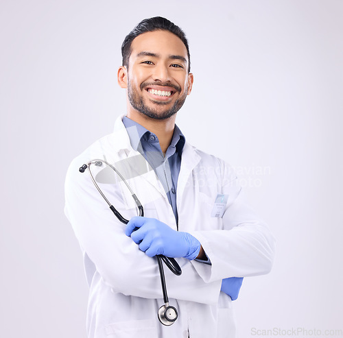 Image of Healthcare, doctor and Asian man with stethoscope, portrait and management on a studio white background. Face, happy consultant and confident medical professional with tool, wellness and motivation