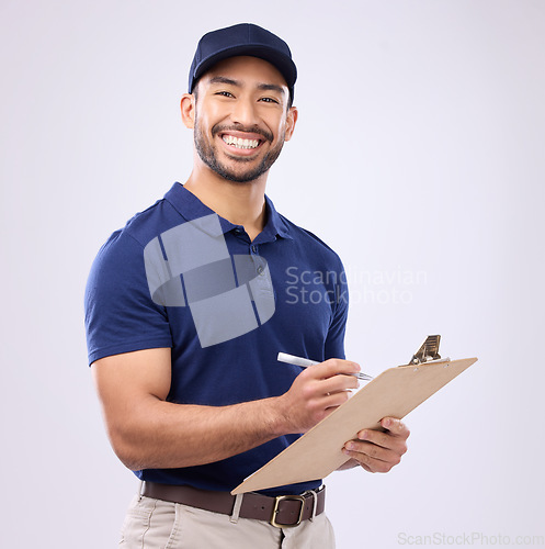 Image of Delivery, checklist and portrait of asian man in studio for shipping, courier or supplier. Logistics, writing and clipboard with male on gray background for ecommerce, postage or package distribution